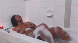 Click to play video Ebony BBW soaps her big tits and masturbates in th